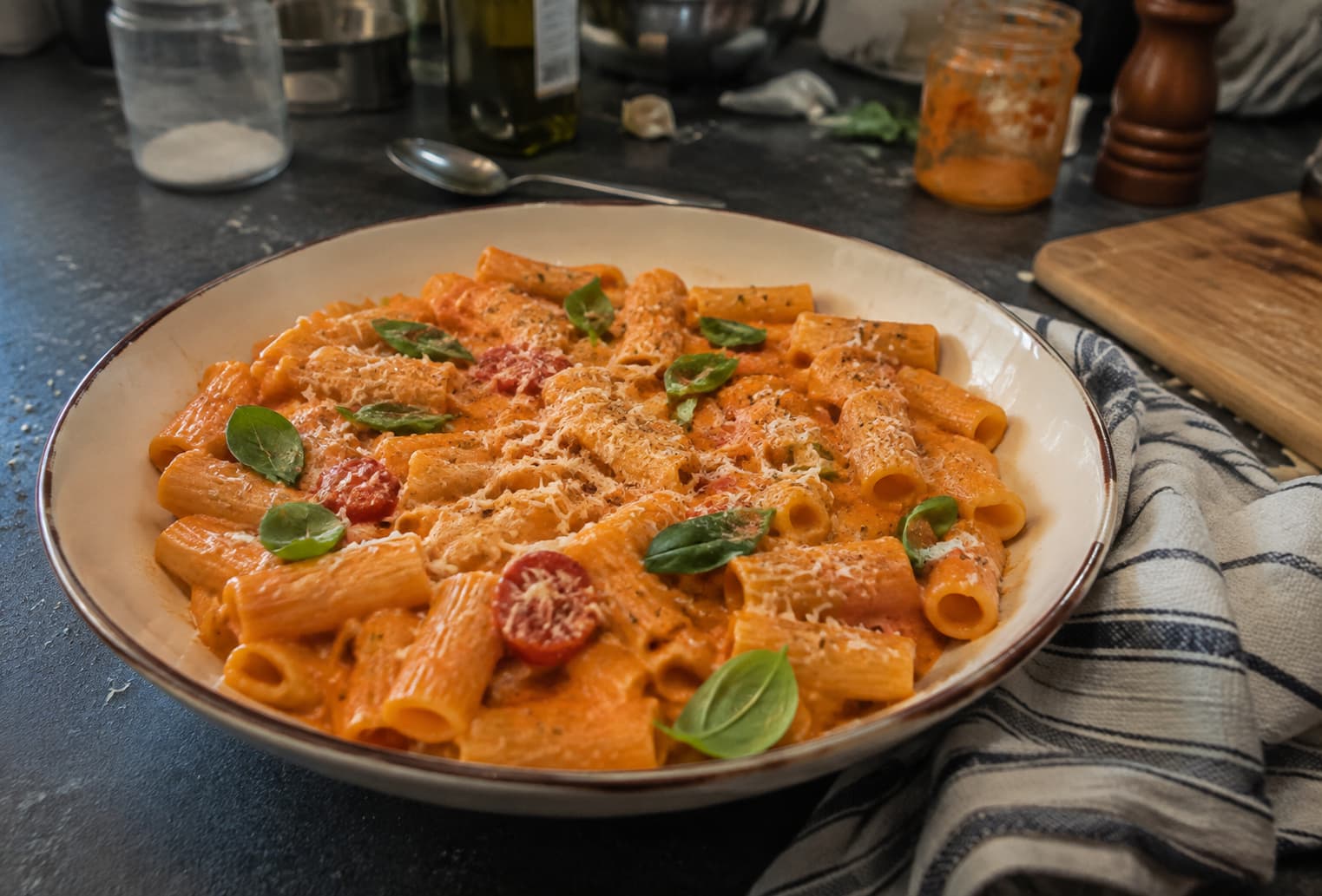 Rigatoni alla vodka on a cluttered home-kitchen counter