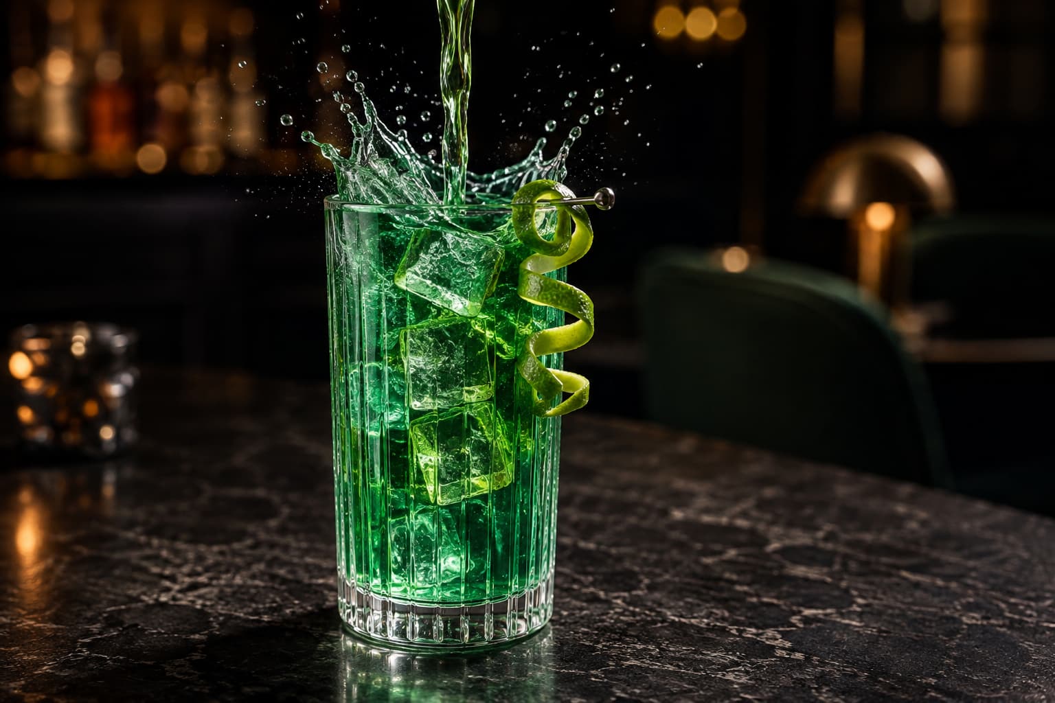 Emerald cocktail photographed from a conventional three-quarter angle during pouring